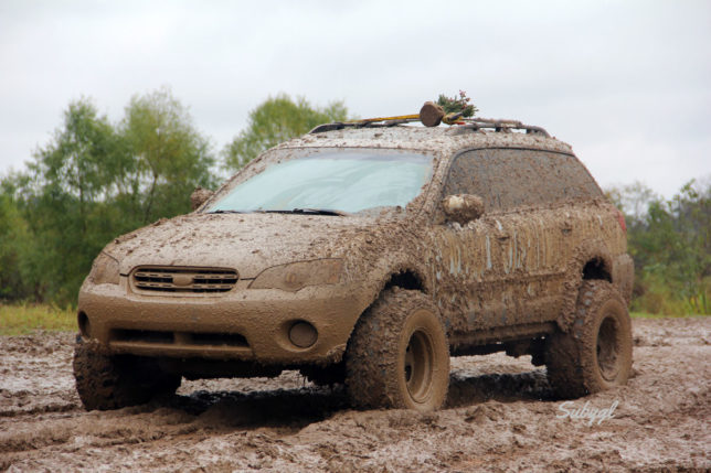 Mud covered lifted Subaru Outback - CRANKSHAFT CULTURE