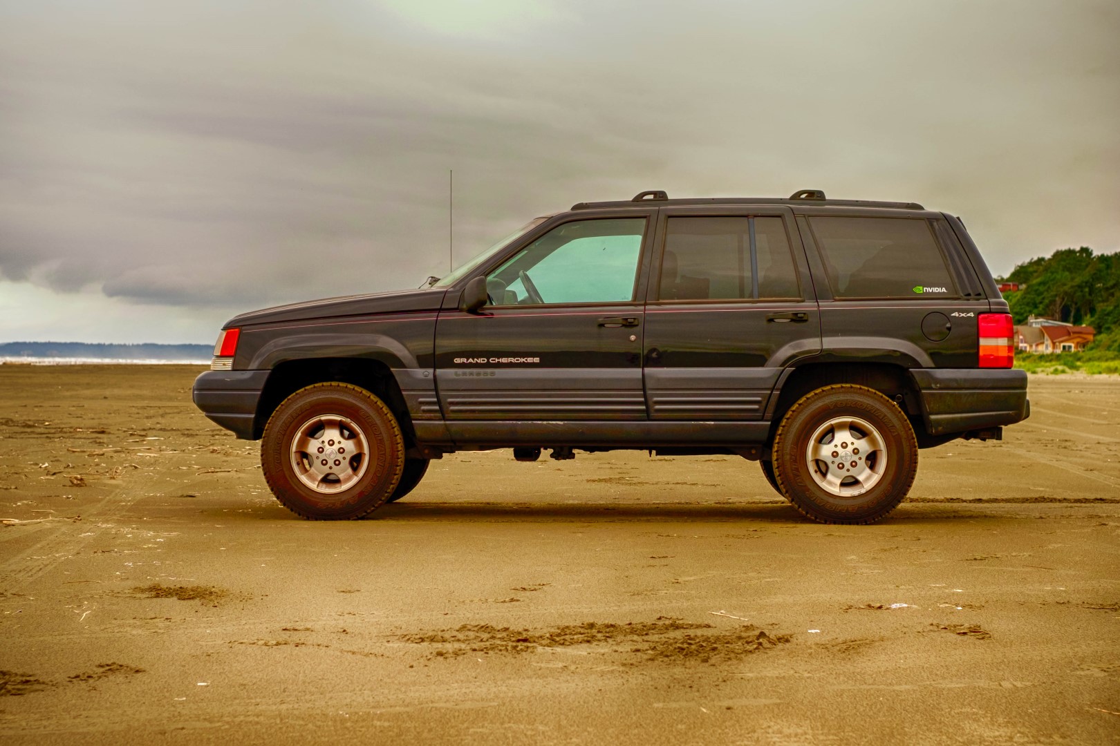 My lifted Jeep Grand Cherokee on the beach. 