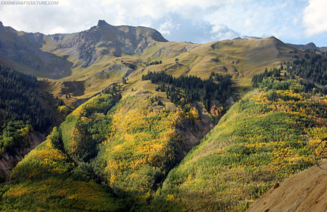 Colorful aspen trees adorn the steep San Juan Mountain hillsides in autumn.