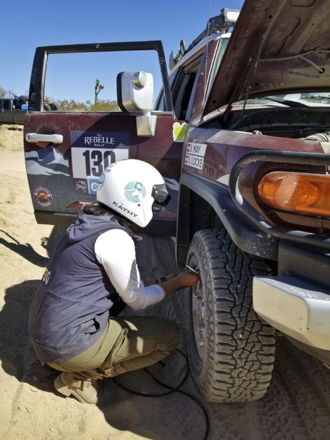 Kathy airing up her tires after a day in the Glamis sand dunes.