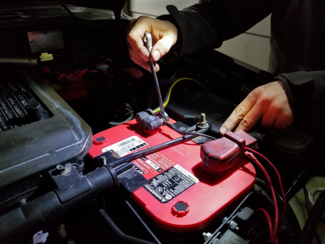 Optima REDTOP battery being installed in a Mitsubishi Pajero