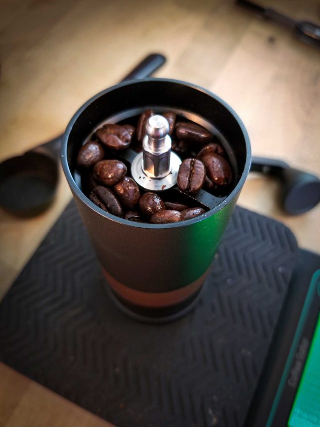 Weighing coffee beans in the VSSL Java coffee grinder. 