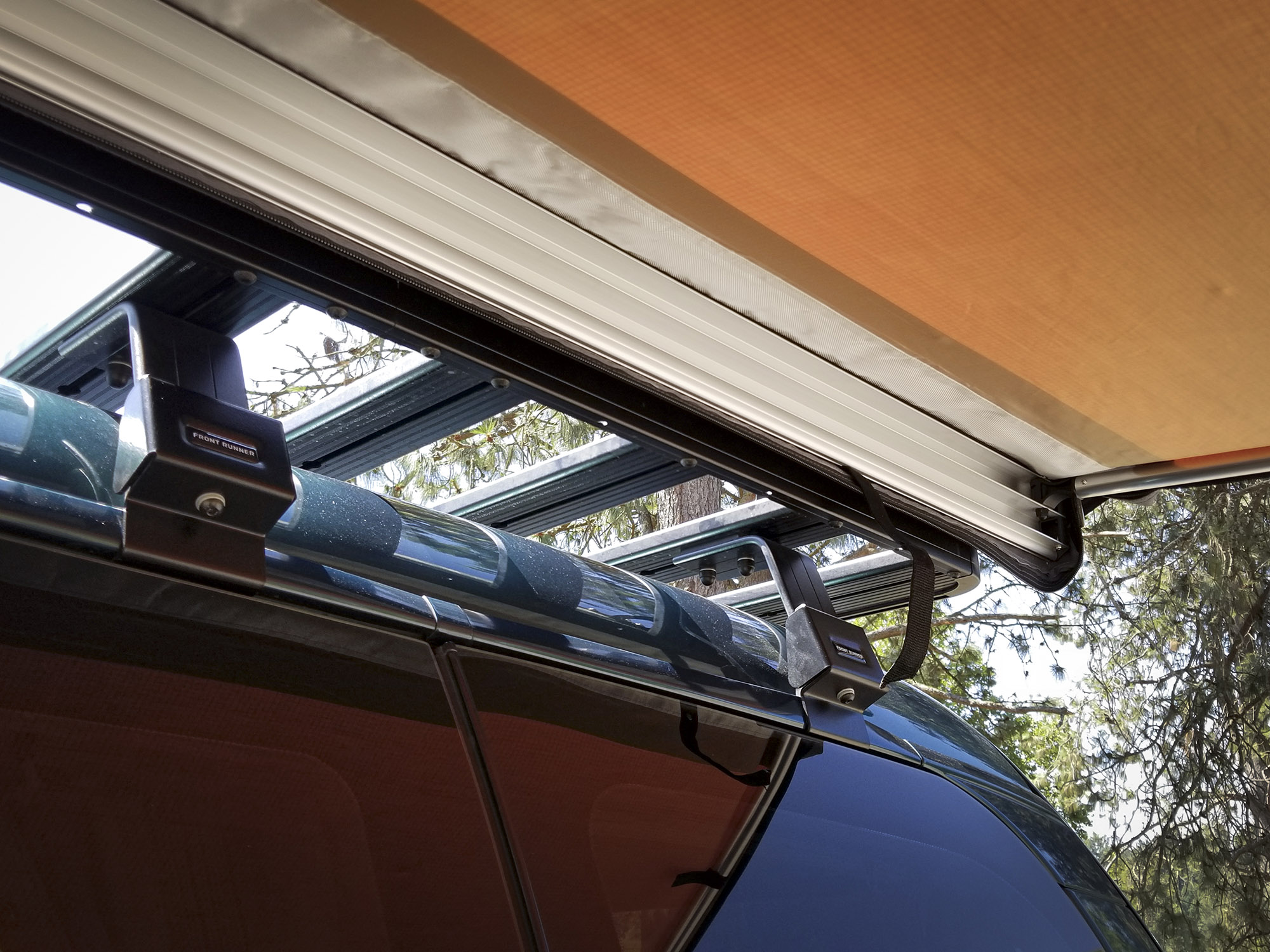 The awning housing features an aluminum chase for support poles and a waterproof zippered bag.