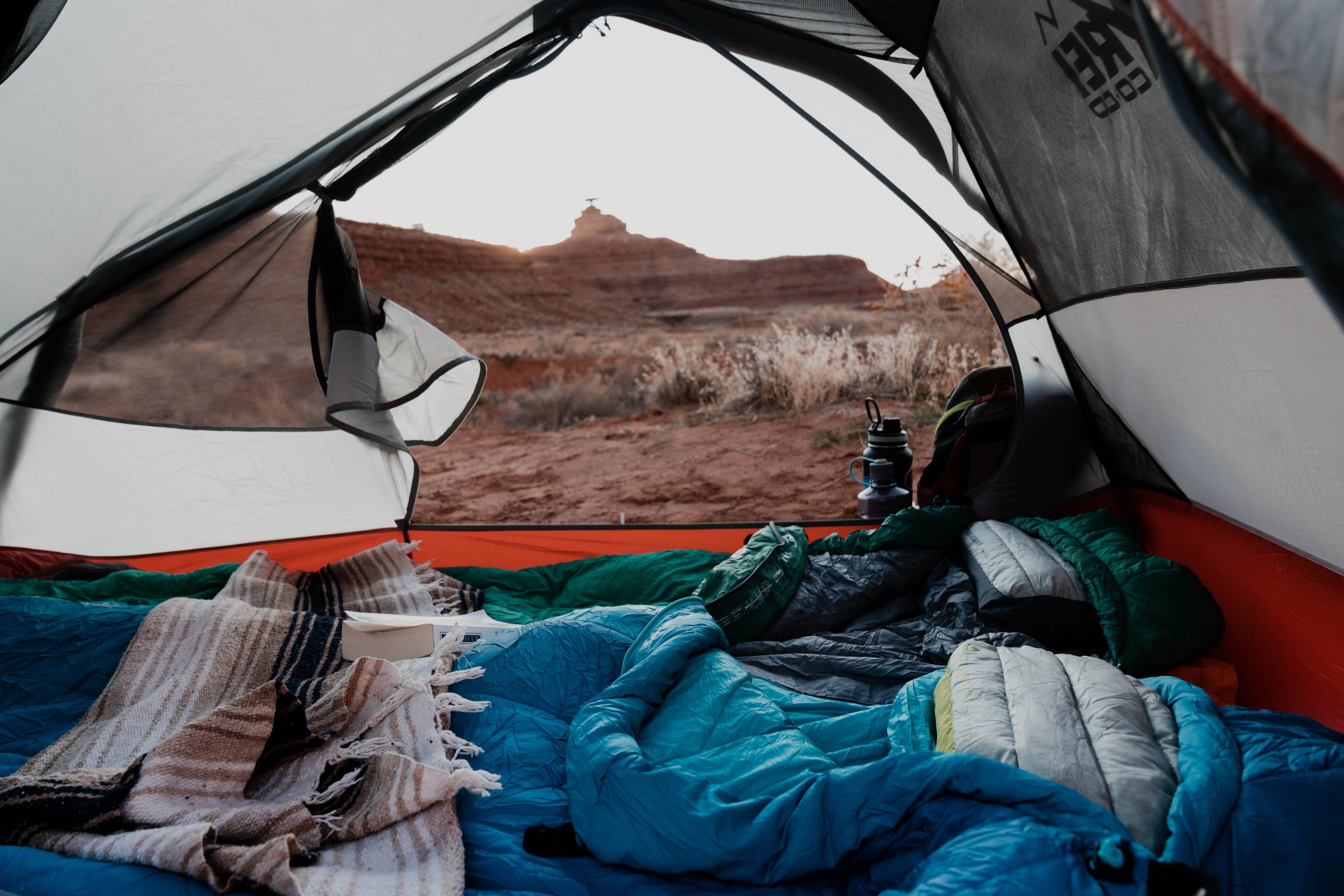 Sea to Summit inflatable pillows in tent with scenic desert background.