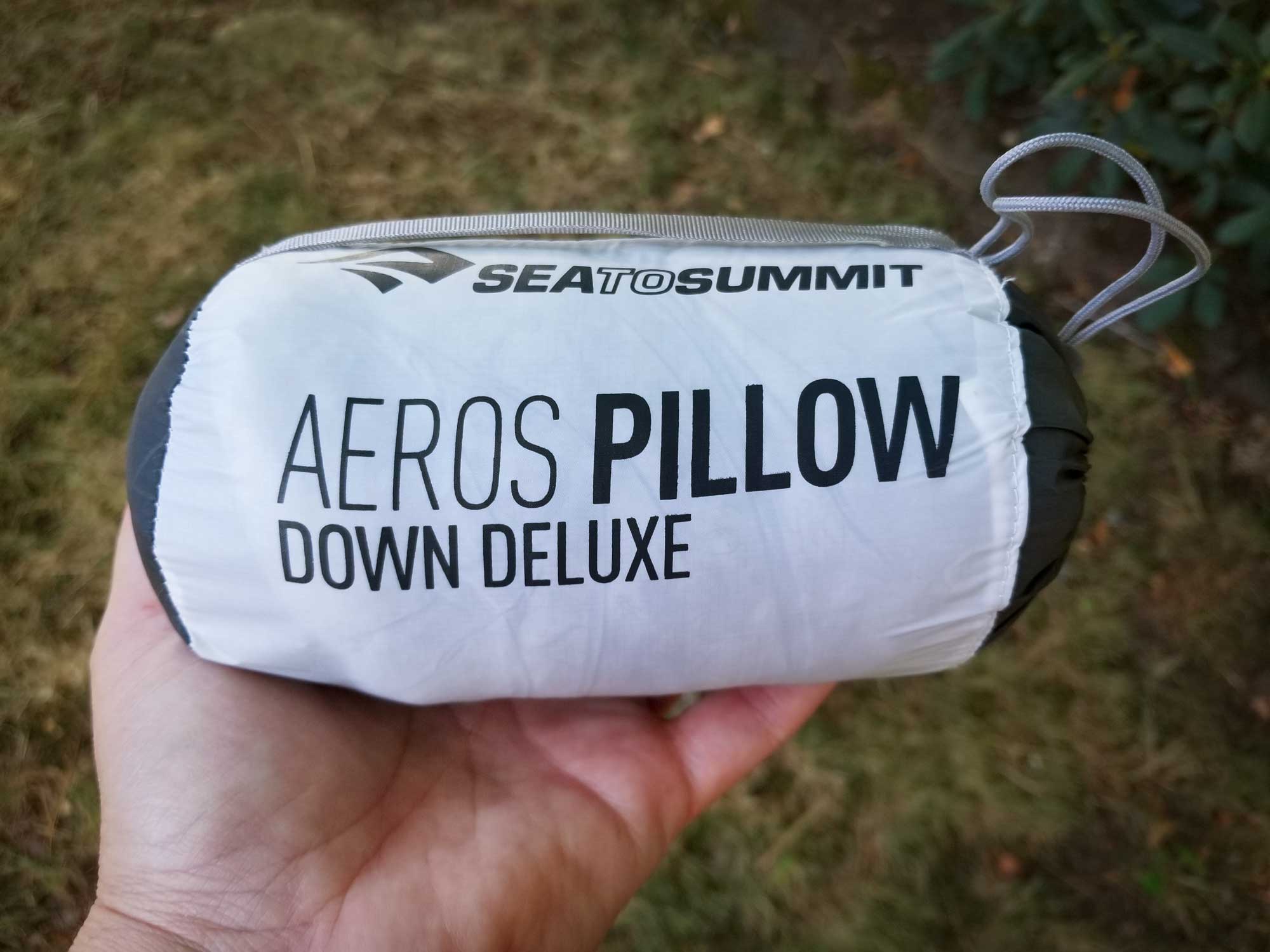 The Sea to Summit Aeros Down Pillow arrives neatly packed in a small white and black stuff sack.