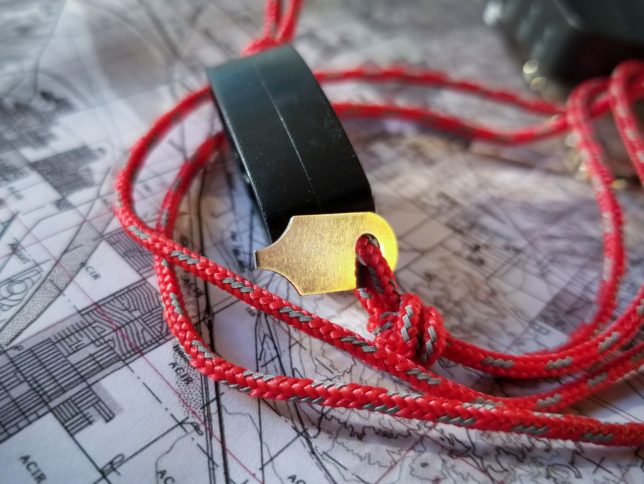 We tied a knot to secure the Suunto MC-2G compass declination key.