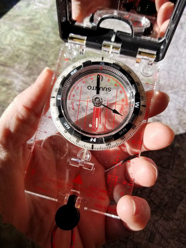 A Suunto MC-2G compass comfortably sits in my hand