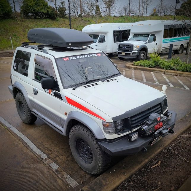 1992 Mitsubishi Pajero with rooftop carrier.