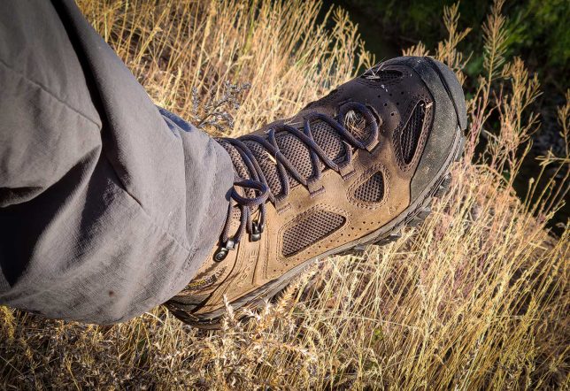 Vasque Breeze Men's hiking boots in a field. 