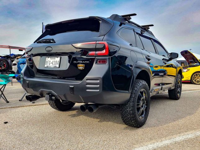Black Subaru Outback Wilderness (rear) at Subiefest Texas 2023.