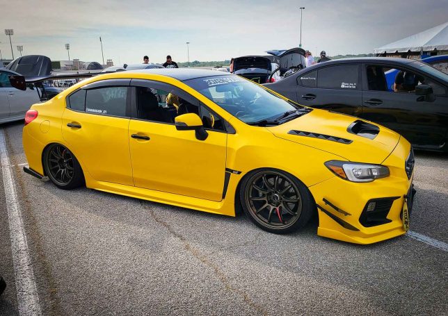 Slammed yellow WRX at Subiefest Texas 2023.