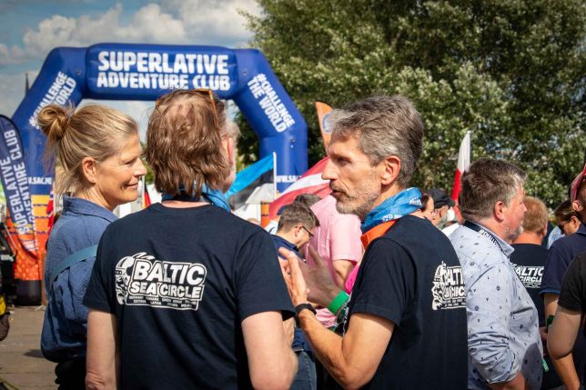 People talking at the 2024 Baltic Sea Circle Rally in Hamburg, Germany.