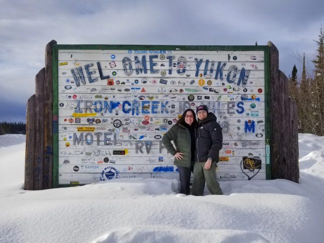 Andy and Mercedes Lilienthal at the Yukon Territory Sign. We appeared on the Overland Journal Podcast.