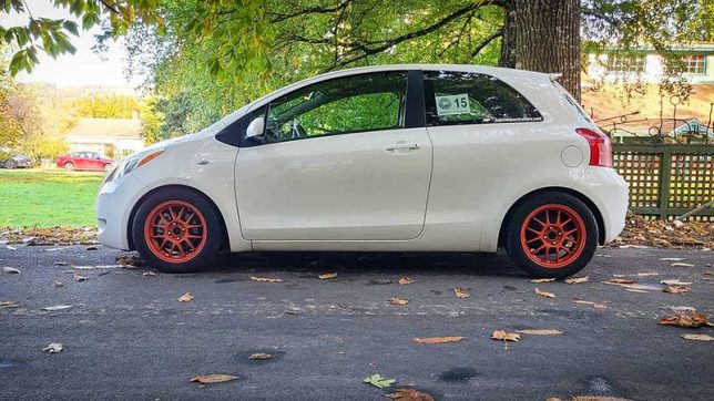 Modified 2007 Toyota Yaris with orange wheels