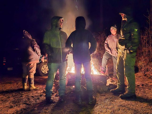 Gathering around the camp fire.