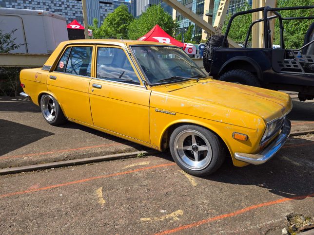 Lowered yellow Datsun 510.