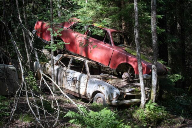 Stacked cars in Sweden's Båstnäs Car Cemetery