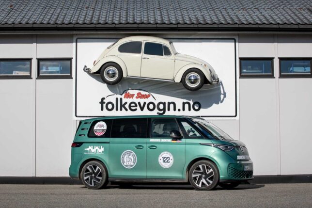 2024 German-market Volkswagen ID. Buzz below a classic Beetle on exterior wall