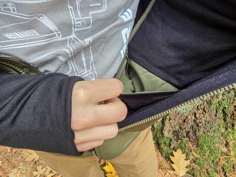 Man wearing Smartwool Smartloft Hybrid Jacket interior open pocket