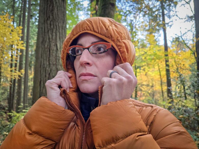 Mercedes wearing Cotopaxi Fuego Max down jacket with hood up