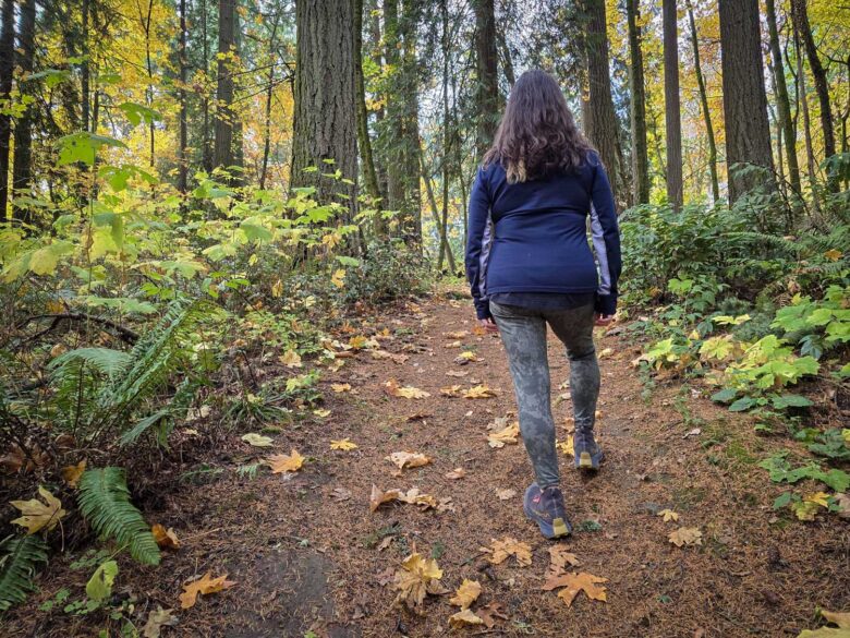 woman wearing Smartwool  Smartloft Hybrid Jacket back side zipped