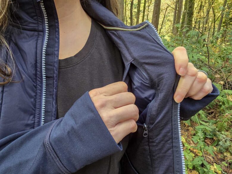 woman wearing Smartwool Smartloft Hybrid Jacket interior pocket
