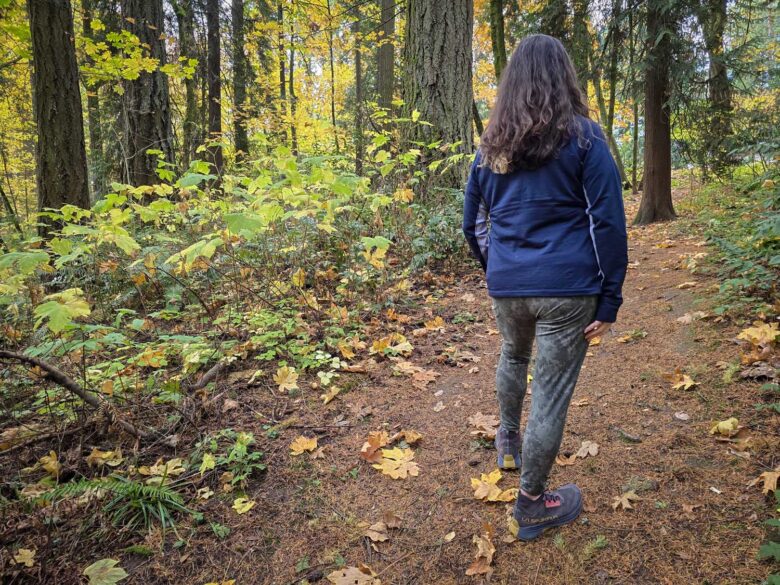 Woman wearing Smartwool Smartloft Hybrid Jacket back opened