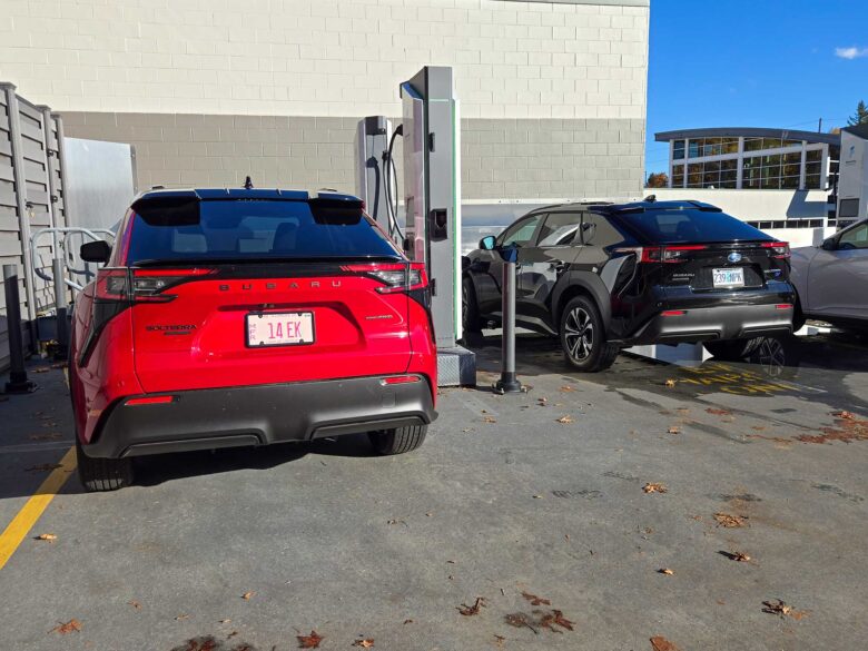 2026 Solterra vs 2025 Subaru Solterra at a charging station.