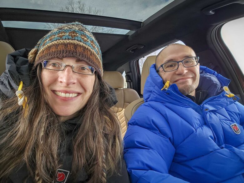 Woman and man wearing Fjallraven Expedition Lite Down Jackets.