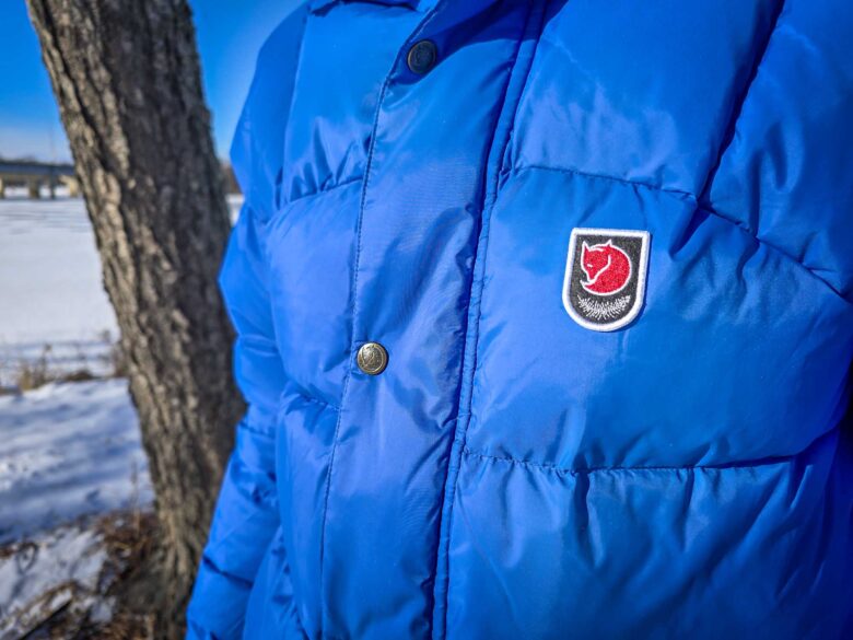 Fjallraven Expedition Lite Down Jackets have heavy duty snaps on their storm flaps