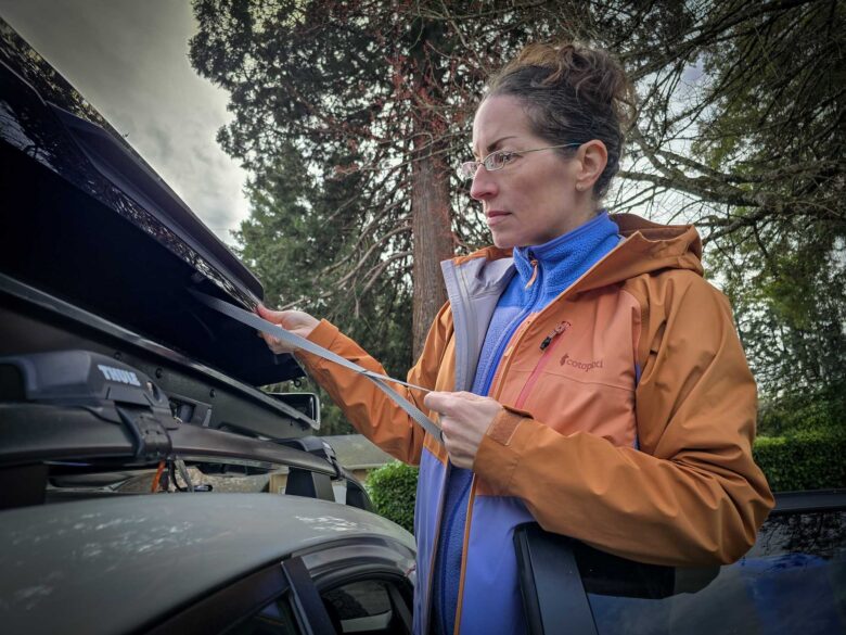 Cotopaxi Impermeo 3L Hooded Shell Jacket with Abrazo Fleece Full-Zip Jacket underneath