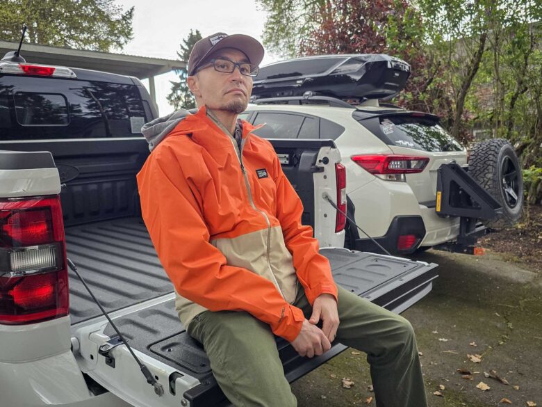 Andy sitting on the tailgate of a Ford Maverick Lobo wearing a Mountain Hardwear Threshold Jacket