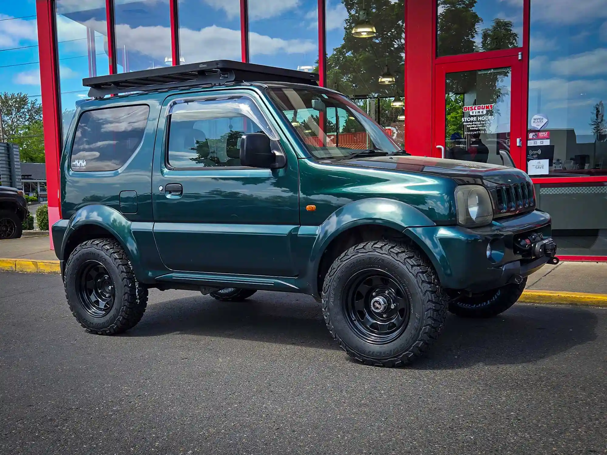 1998 Suzuki Jimny Wide on 215/75/15 BFGoodrich All-Terrain KO3 tires.