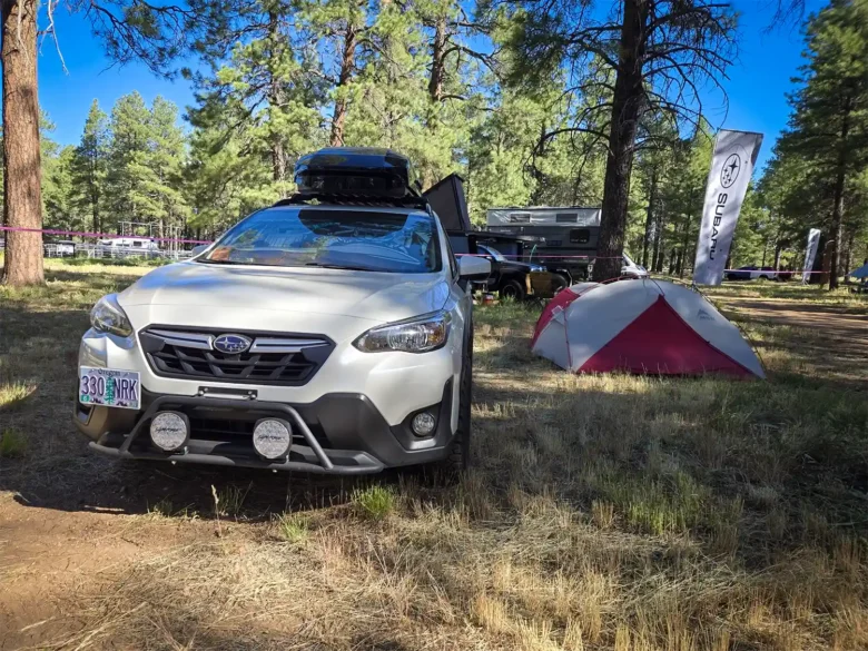 Our 2022 Subaru Crosstrek and MSR tent camping in the Subaru Base Camp area at Overland Expo 2026.