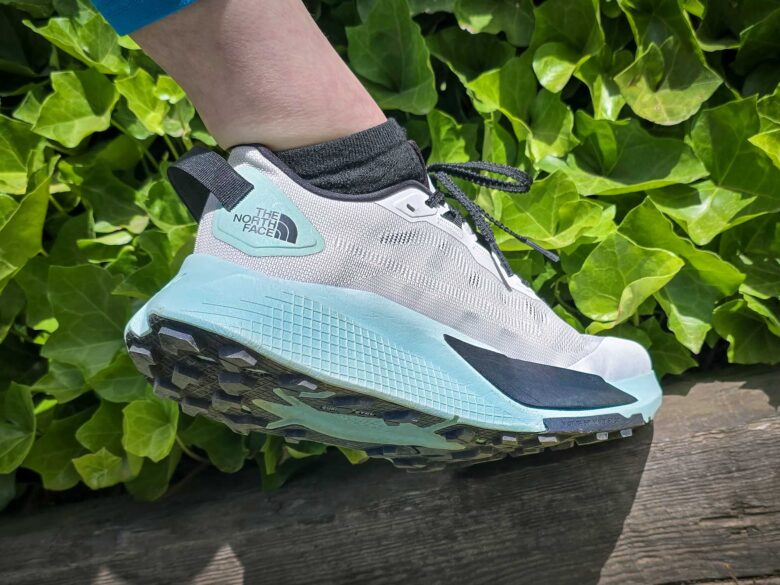 The North Face Altamesa 500 V2 shoes showing sole while sitting on log