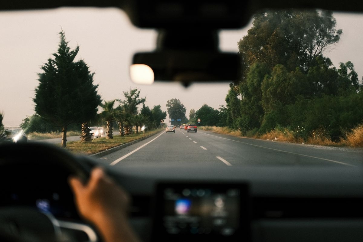 Car diving down a two-lane road